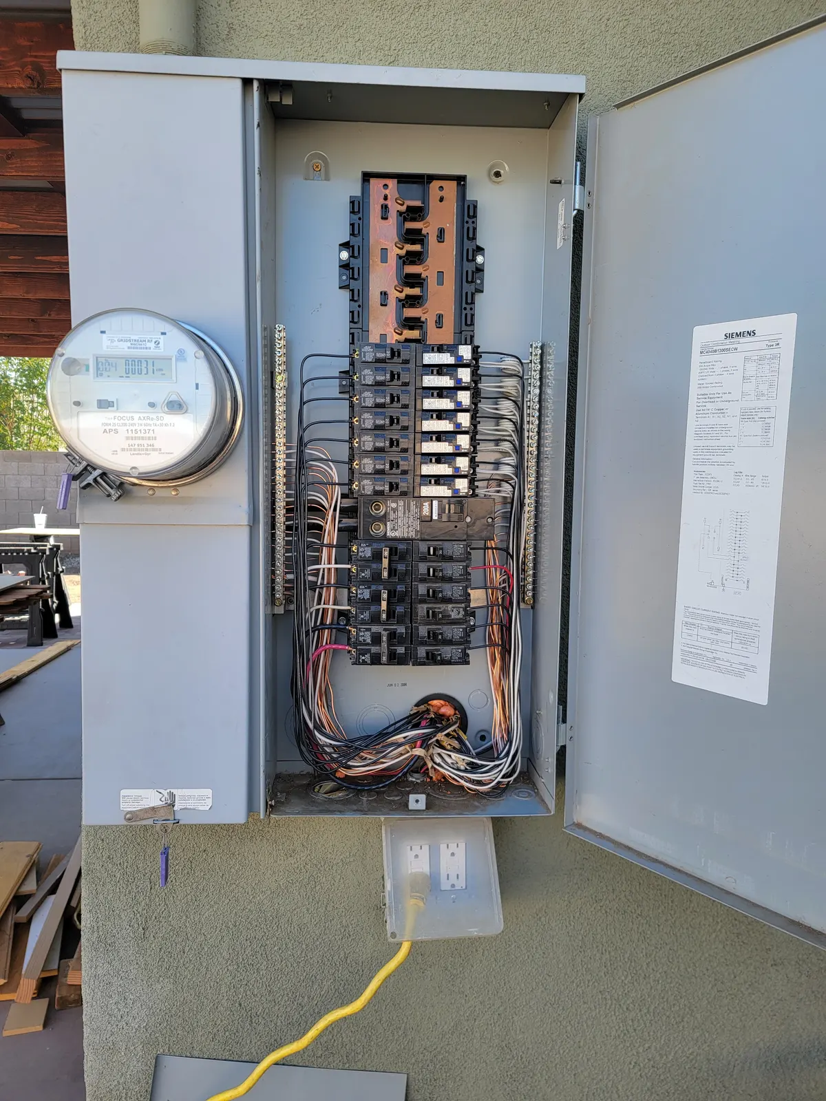 Upgraded 200-amp electrical panel with meter, breakers, and organized wiring